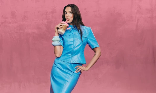 Dua Lipa enjoys a drink