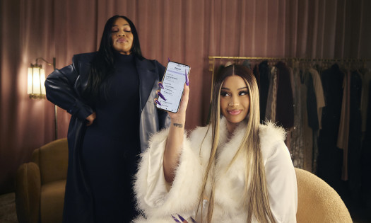 Cardi B holding up the new Yahoo Mail planner