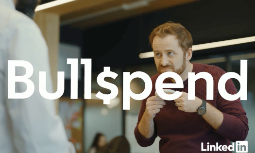 A screenshot from LinkedIn's campaign creative showing the word "Bullspend" in large white text