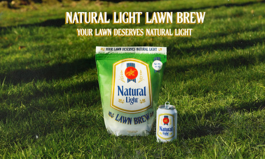 Natural Light's Lawn Brew fertilizer pictured sitting on a grass lawn, with a Natural Light beer can sitting beside it