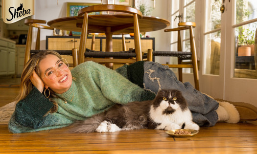 Haley Lu Richardson pictured with her cat, Darbin for SHEBA's latest campaign