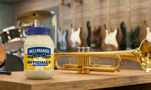 A Hellmann's jar beside a trumpet