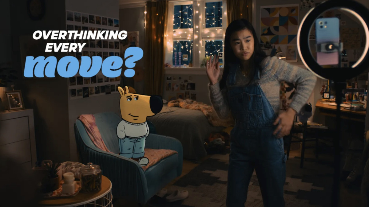 A young girl in the bedroom with the "chill guy" meme