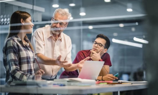 Students and a professor in one of the best app development schools