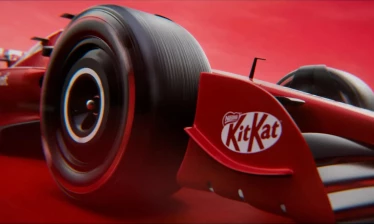 An F1 racing car with the KitKat logo