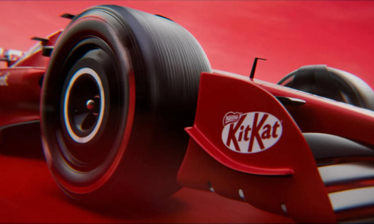 An F1 racing car with the KitKat logo