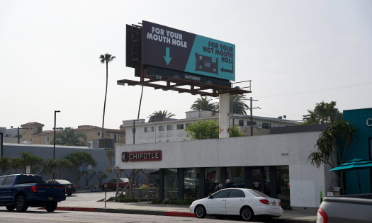 DUDE Wipes' campaign billboard above an LA Chipotle location, reading "For Your Mouth Hole, For Your Not Mouth Hole"