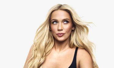 Megan Moroney pictured in Revlon's latest brand platform "Be Unforgettable"