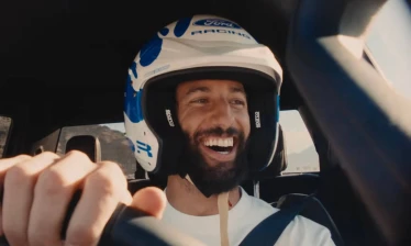 Daniel Ricciardo inside a Ford vehicle