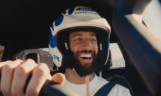 Daniel Ricciardo inside a Ford vehicle