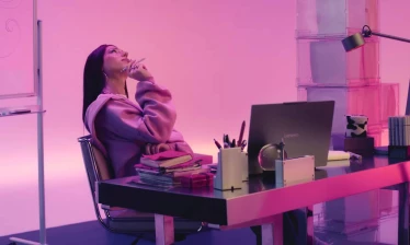 A woman in a pink jacket