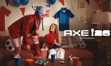 Two football fans in the living room