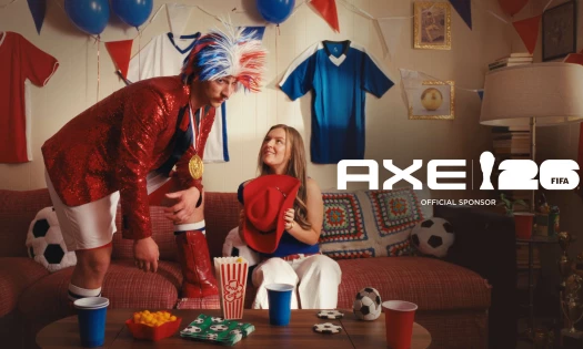 Two football fans in the living room