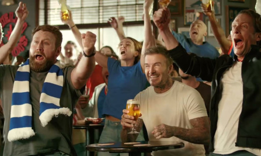 David Beckham celebrating with football fans