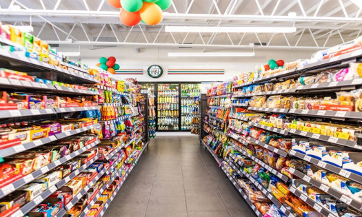 Inside a 7-Eleven store with aisles of snacks