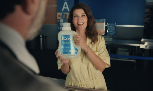 Nia Vardalos holding a bottle of ECOS laundry detergent in the brand's latest campaign spot for Earth Day 2026