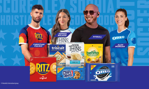 Pulisic, Wilson, Pitbull, and Morgan stand in the background and assorted brand products are at the forefront