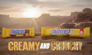 SNICKERS Peanut Butter and Peanut Butter Ice Cream Bars in a canyon. Creamy and Crunchy typography under the bars.