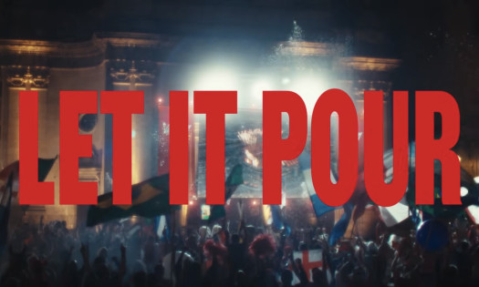 Erling Haaland pictured in a crowd with people waving Norwegian flags