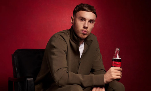 Cole Palmer pictured holding a Coca-Cola Zero bottle