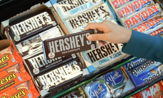 Vinny Rinaldi, VP of consumer connections. Hershey's dark range act as the background.