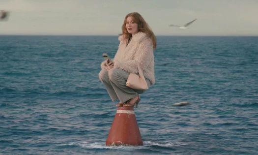 A woman in the middle of the ocean