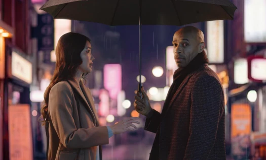 Thierry Henry and a woman under the rain