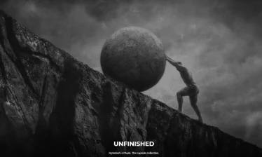 Chris Bumstead pushing boulder up mountain in black and white campaign image for Gymshark x CBum "Unfinished" capsule collection