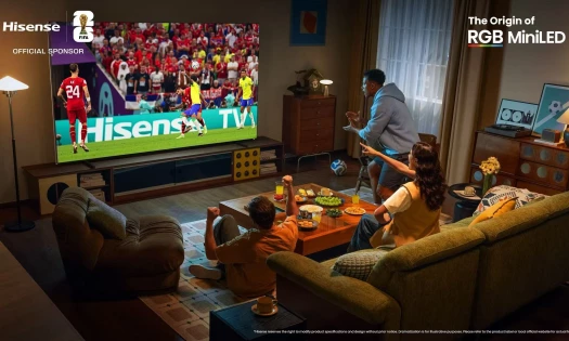 Three friends watching a football game on a Hisense RGB MiniLED TV.