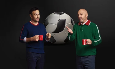 Landon Donovan and Luis García with a cup of NESCAFÉ