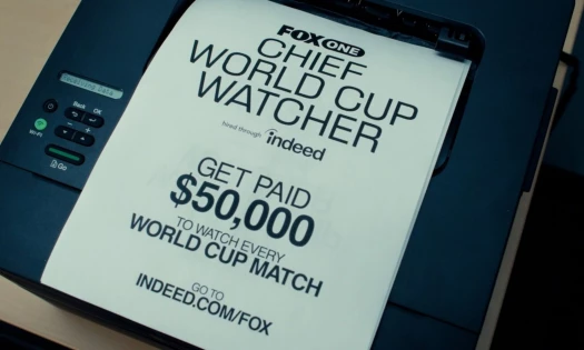 FOX One Chief World Cup Watcher job flyers resting on a printer.