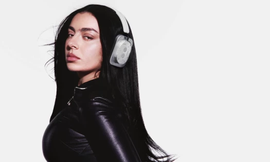 Charli XCX with Nothing headphones