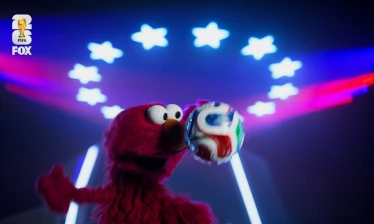 Elmo with a football
