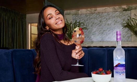 Zoe Saldaña with a Grey Goose cocktail