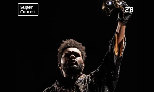 The Weeknd holding a metallic mask for the Hyundai Card Super Concert 28 poster