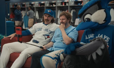 Michael Cera chilling in the couch with the Toronto Blue Jays