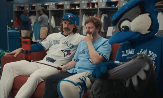 Michael Cera chilling in the couch with the Toronto Blue Jays