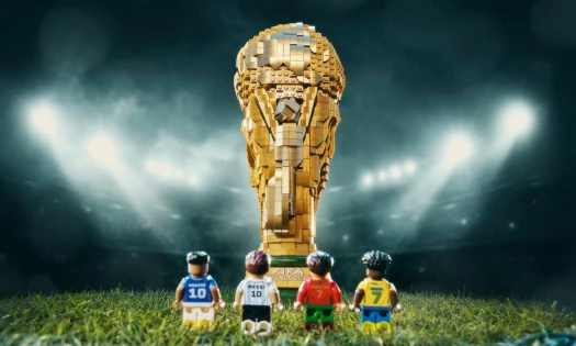 Cristiano Ronaldo pictured building a LEGO World Cup trophy build in the brand's "Everyone Wants a Piece" campaign