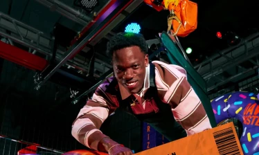A man in Dave & Buster's Human Crane