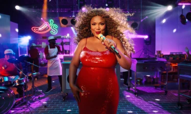 Lizzo with a live band in a Chili's