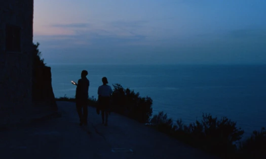 Two people by the sea