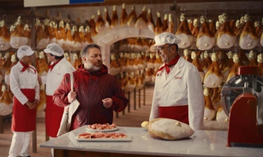 A chef talks to a customer