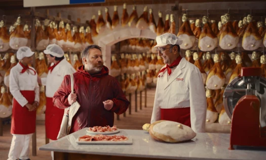 A chef talks to a customer