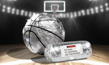 A basketball and a burrito wrapped in tinfoil