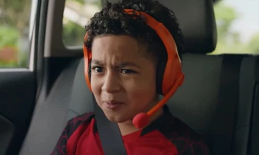 A kid wearing a plastic headset