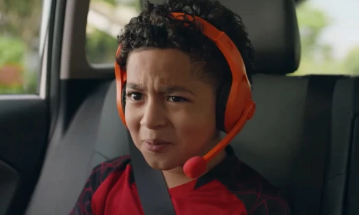 A kid wearing a plastic headset