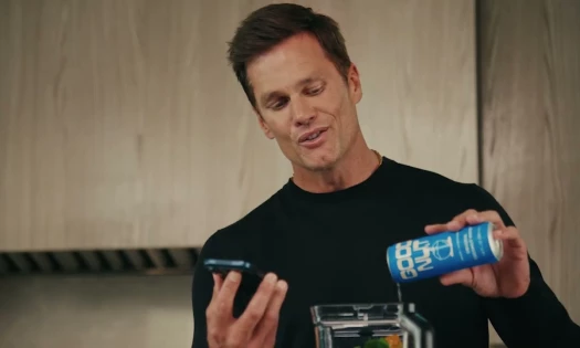 Tom Brady with a carton of Good Nut