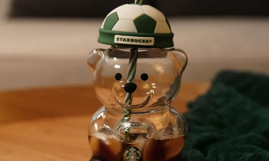 Starbucks Bearista Cup with a soccer ball-styled hat.