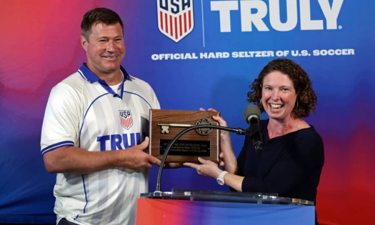 Mayor Jabbour presents Brian McBride with the key to Hoboken