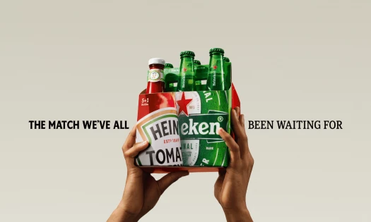 A co-branded Heinz and Heineken six-pack shows one ketchup bottle replacing a beer bottle under the line “The match we’ve all been waiting for.”